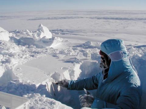 UNH Researcher taking samples in the Arctic